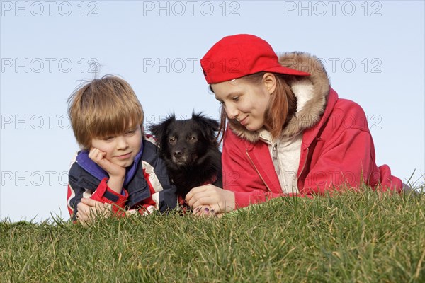 Boy and girl with a dog