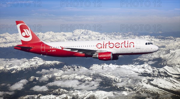 Air Berlin Airbus A320-214 in flight over the Alps