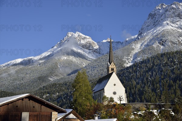 Reformed Church of St. George in front of mountains