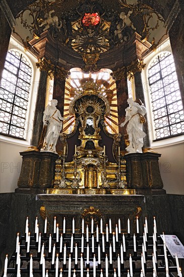 Side altar with votive candles