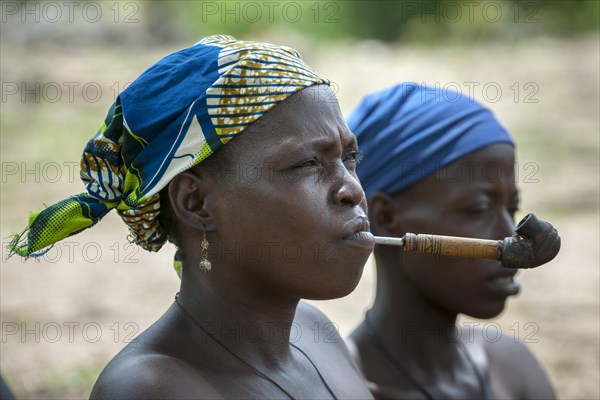 A woman from the Koma people smoking a pipe