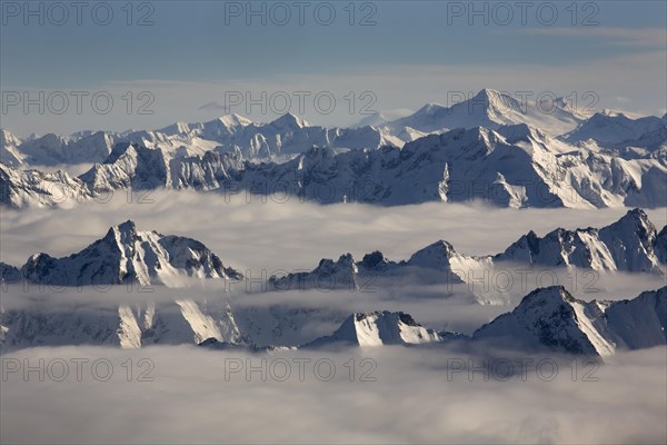 The peaks of the Zillertal Alps rising above the sea of fog