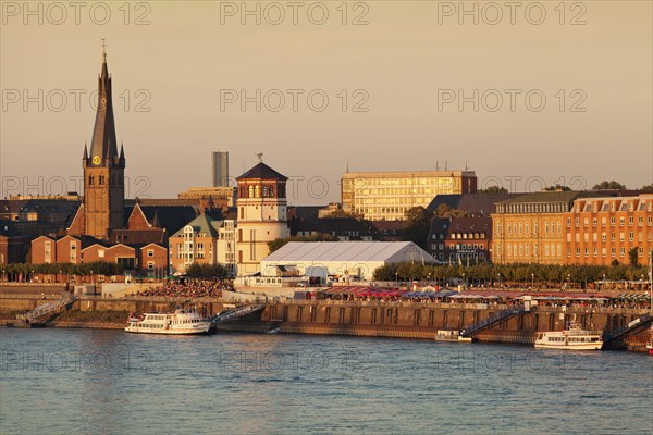 Dusseldorf's historic town centre with St. Lambertus Church and Schlossturm tower on the Rhine promenade