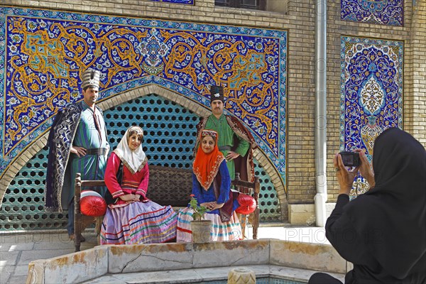 Wedding couples having their pictures taken in traditional costume