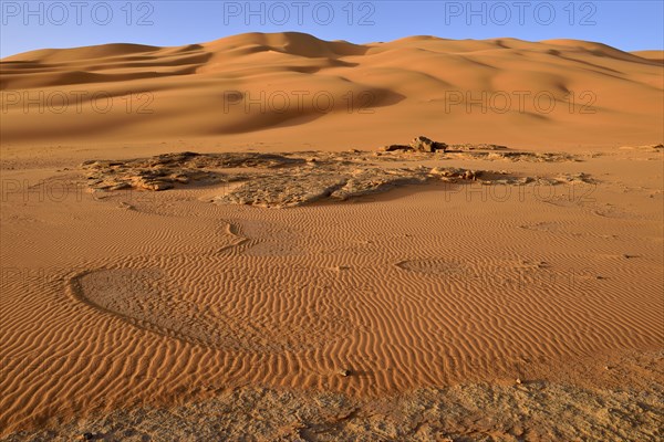 Sand dunes and sandstone rocks at Oued In Djerane