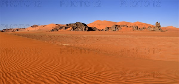 Sand dunes and rocks at Tin Merzouga