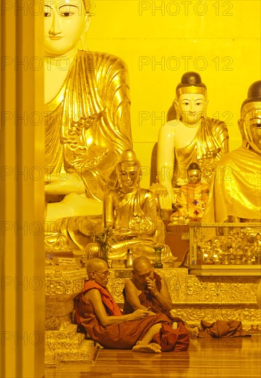 Two Buddhist monks with a mobile phone