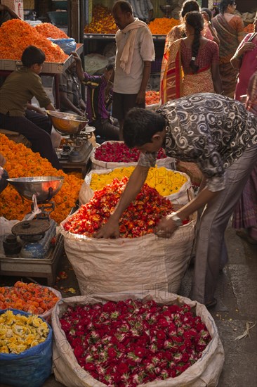 Flower seller at a market stall