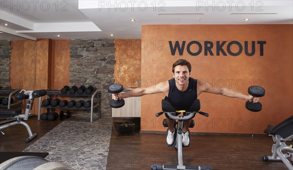 Man doing fitness exercises in a gym