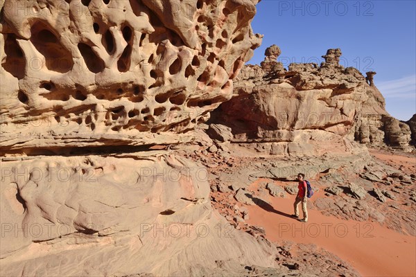 Woman hiking in the rocky landscape of the Cirque