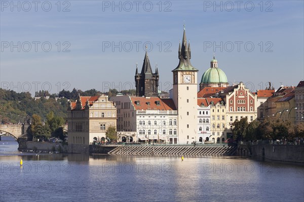 View over the Vltava River to the Bedrich Smetana Museum and the Old Town Bridge Tower