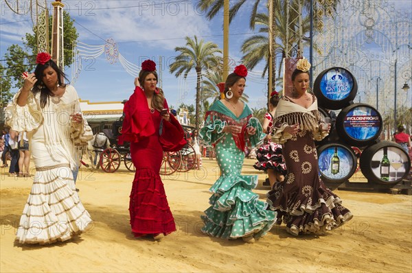 Women wearing gypsy dresses at the Feria del Caballo