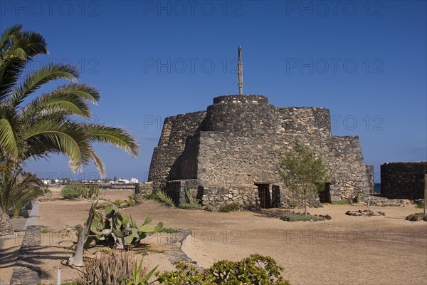 Historic fortress complex on the beach promenade of Caleta de Fuste