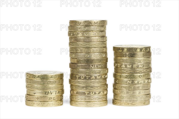 Piles of UK sterling pound coins