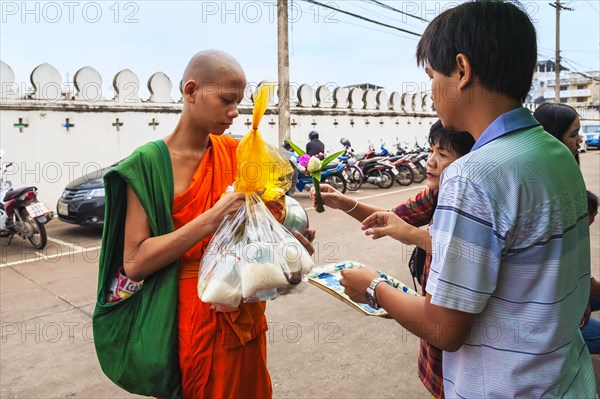 Monk receiving alms