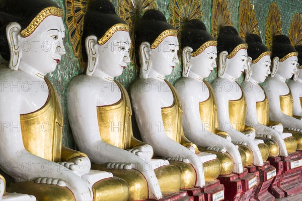 Many seated Buddha sculptures