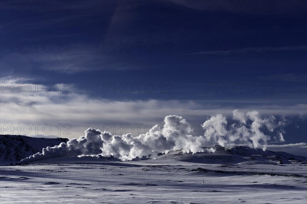 Geyser in a snow-covered landscape