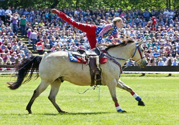 Trick riding in an arena