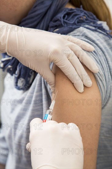 Young woman getting a flu shot
