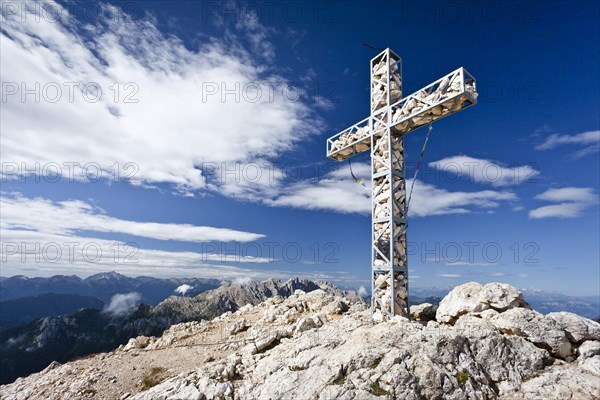 Summit cross of Croda Rossa or Sextener Rotwand in the Rosengarten Group