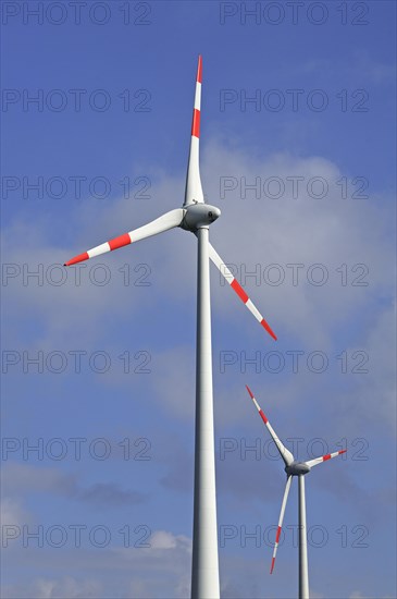 Wind turbines against blue sky