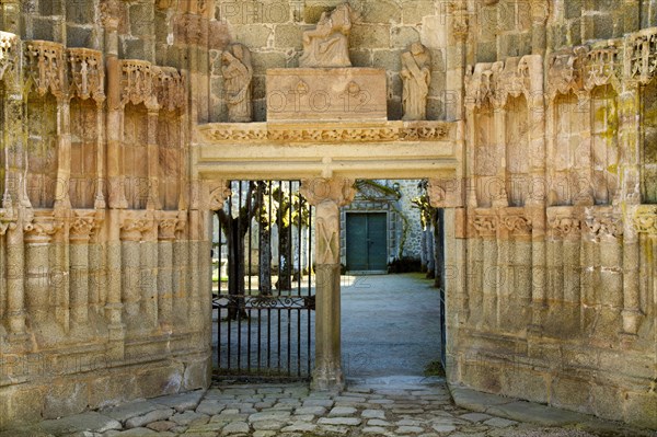 Carved stone portal gate to the courtyard of the Abbey of Moutier-d'Ahun