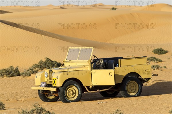 Land rover from the 50s before sand dunes