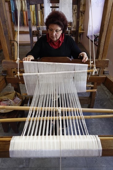 Woman working on a loom