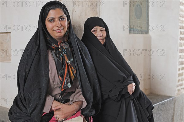 Daughter and mother in a chador