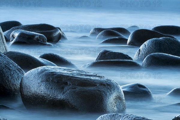 Round stones in the surf