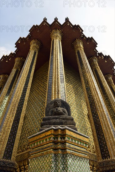 Buddha statue in front of the Mondop