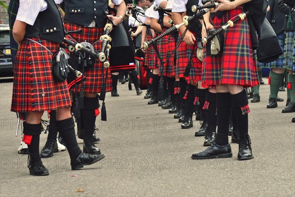 Members of a pipe band wearing kilts