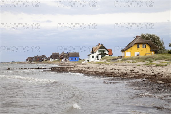Cottages with thatched roofs on the coast