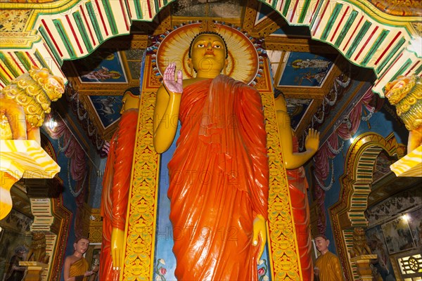 Statue in the old Buddhist temple complex of Sri Pushparama Maha Viharaya