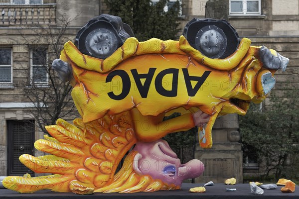 Yellow angel in a car standing on its head