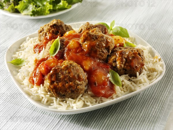 Meat balls with a ragu sauce on rice