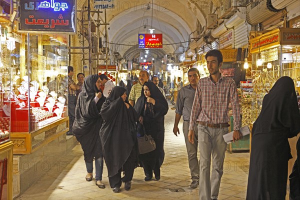 Women in chadors in the bazaar