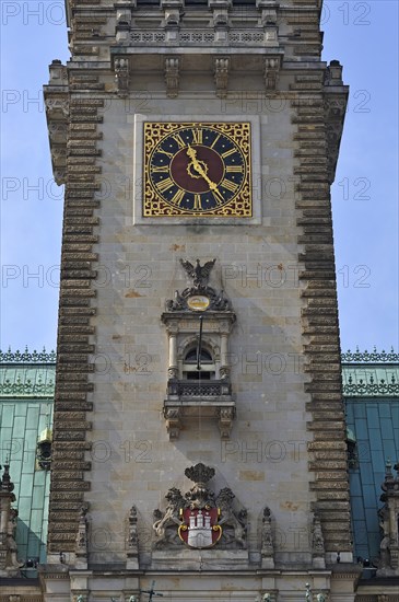 City coat of arms and clock on the tower