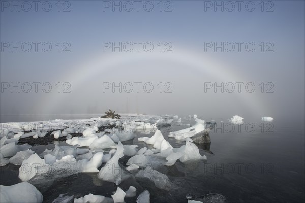 A fog rainbow and beached icebergs at Pakenham Point