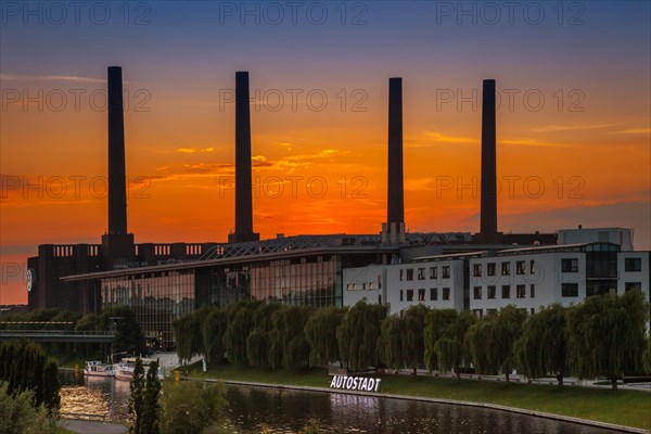 VW KonzernForum premises with the entrance to the Autostadt complex and the heating station of the Volkswagen plant with its four chimneys