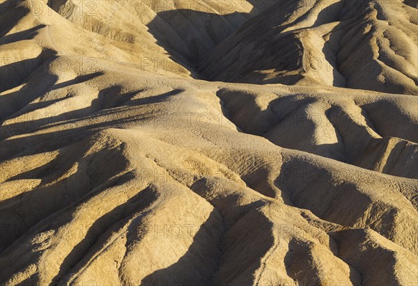 Eroded badlands in the Gower Gulch seen from Zabriskie Point in the evening light