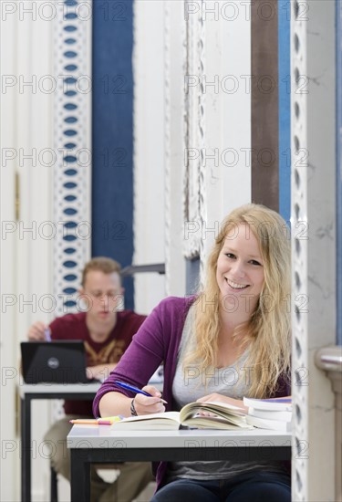 Students studying in the departmental library of the University of Hohenheim in Schloss Hohenheim Palace