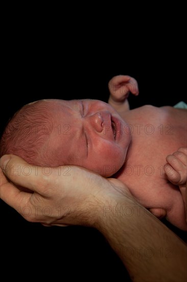 Father holding a baby