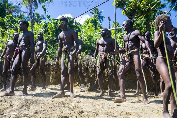 Men dancing at traditional community ritual