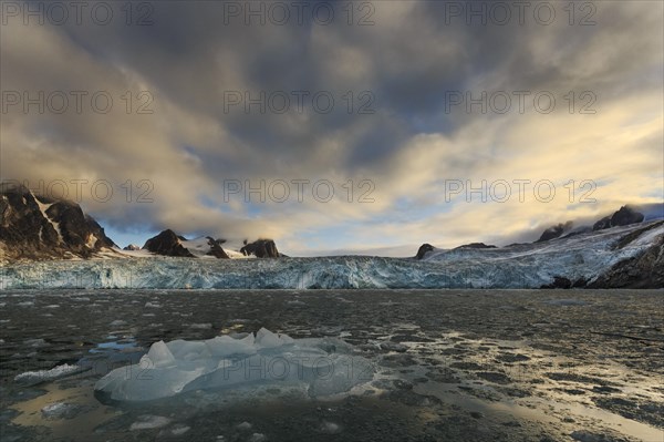 Iceberg in front of glacier