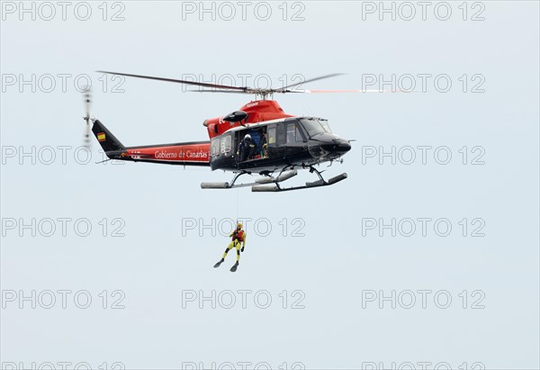 Air-sea rescue service exercise with a frogman on a winch