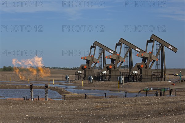 Natural gas is flared off as oil is pumped in the Bakken shale formation