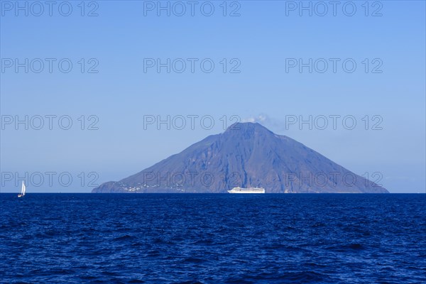 Isola Stromboli with erupting volcano Mt Stromboli