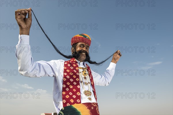 Local man presenting his long mustache