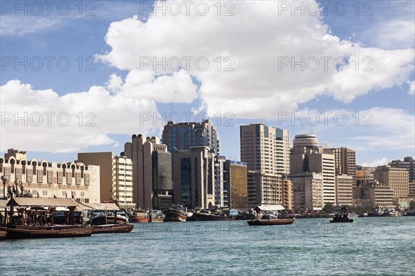 Heavily laden traditional dhows on the Dubai Creek